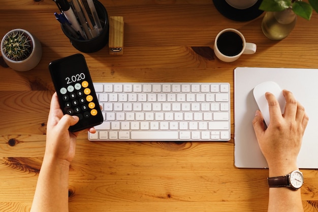 Closeup shot of an entrepreneur working from home and doing calculations