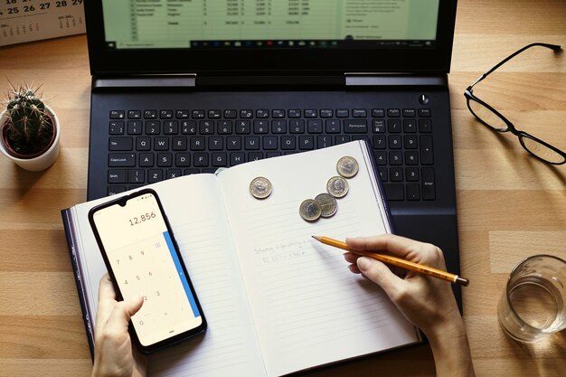 Closeup shot of an entrepreneur working from home on his personal finances and savings