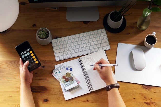 Closeup shot of an entrepreneur working from home on his personal finances and savings