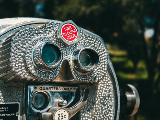 Closeup shot of a gray viewing telescope in a park