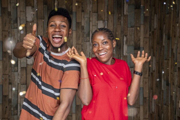 closeup shot of a happy young man and woman celebrating