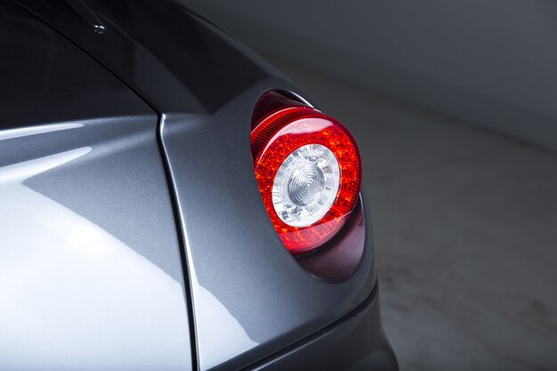 Closeup shot of the headlights of a modern silver car