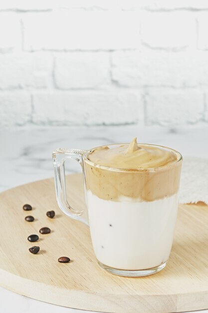 Closeup shot of iced Dalgona whipped coffee with fluffy creamy