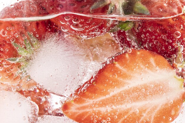 Closeup shot of iced strawberries in a glass