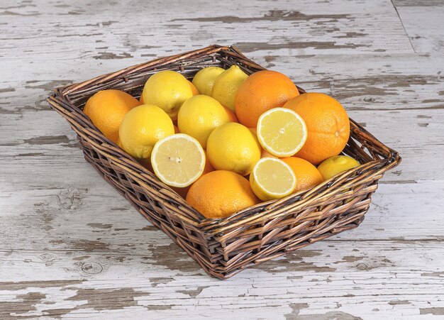 Closeup shot of lemons and oranges in the basket