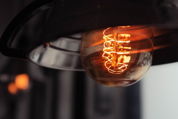 Closeup shot of a lit large lightbulb with a blurred background