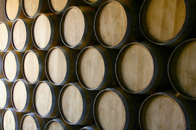 Closeup shot of a lot of wooden wine barrels