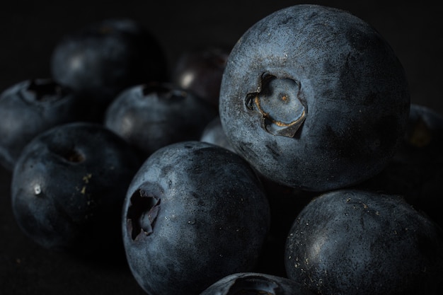 Closeup shot of many blueberries one on another