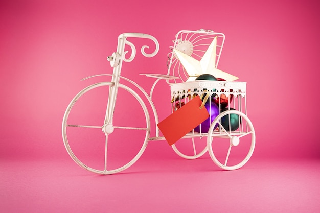 Closeup shot of a metal bicycle with Christmas toys in it