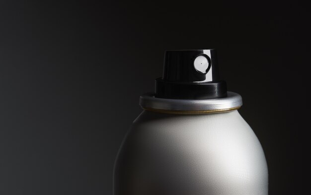 Closeup shot of a metal bottle with spray