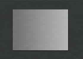 Free photo closeup shot of a metal sheet on a grey leather background