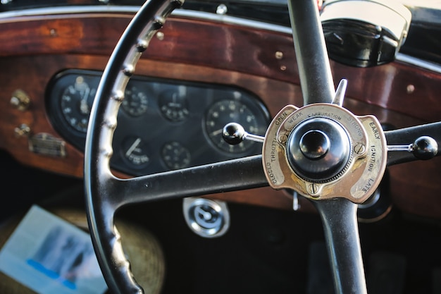 Closeup shot of the metal steering wheel of a vehicle