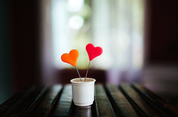 Free photo closeup shot of a muffin with colorful hearts on it