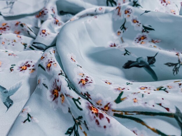 Closeup shot of nice bed sheets with flowers
