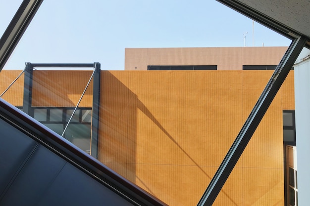 Closeup shot of orange building seen through a glass window