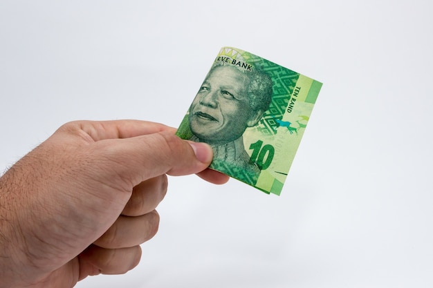 Closeup shot of a person holding cash on a white