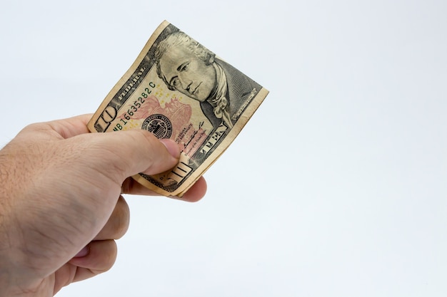 Closeup shot of a person holding a dollar bill over a white background