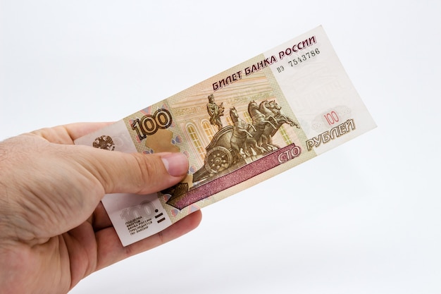 Free photo closeup shot of a person holding some cash over a white isolated