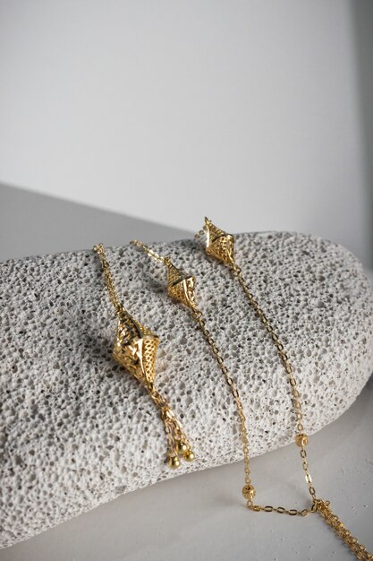 Closeup shot of pieces of expensive golden jewelry in a store