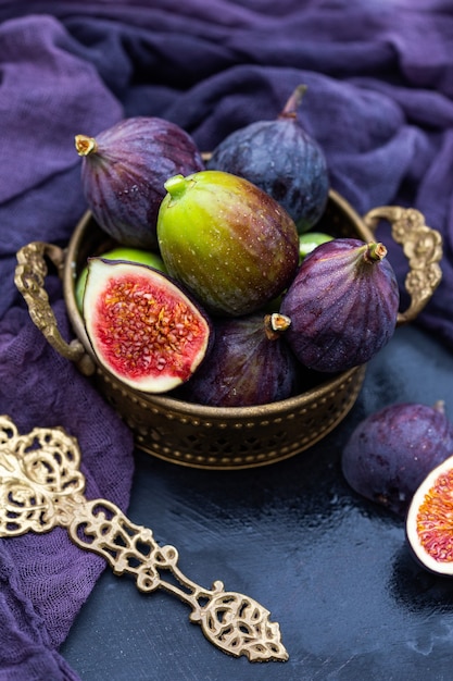 Closeup shot of purple and green fresh fig in a basket