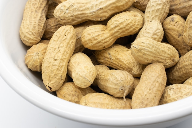 Closeup shot of raw peanuts in shells
