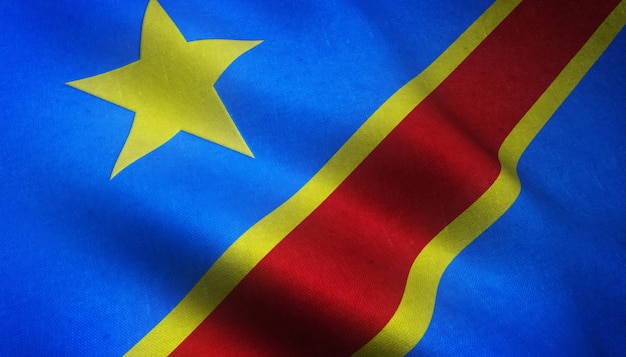 興味深いテクスチャとコンゴ民主共和国の現実的な旗のクローズアップショット