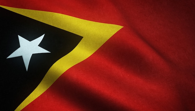 Closeup shot of the realistic flag of East Timor with interesting textures