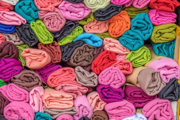 Closeup shot of several pieces of multicolored clothing stacked on top of each other