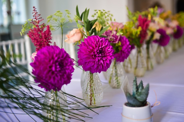 Closeup shot of small vases with beautiful purple hortensia flower