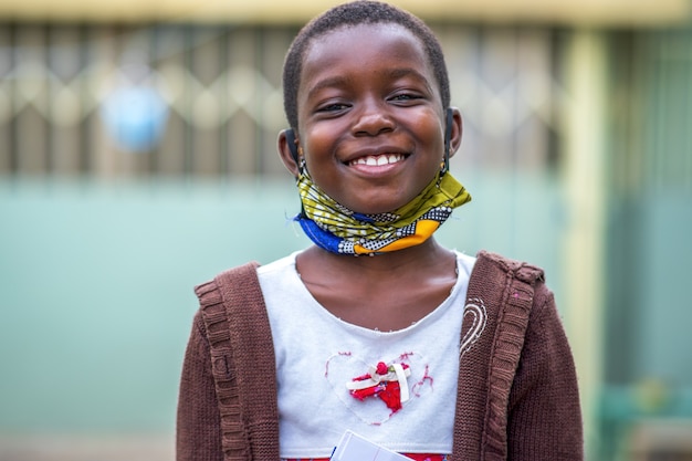 Closeup shot of a smiling black male child happiness concept