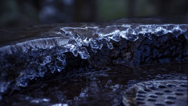 Closeup shot of a stone fountain with dripping water