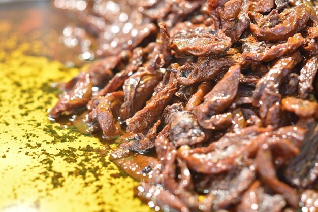 Closeup shot of a tasty dish made with meat and sauce in a metal container