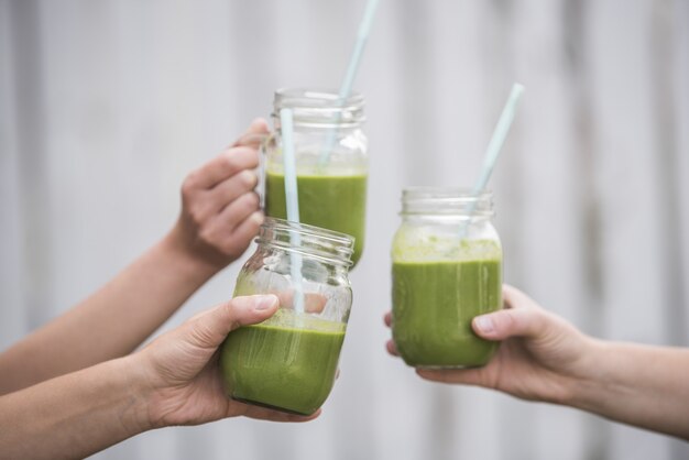 Closeup shot of tasty green vegan fresh smoothie