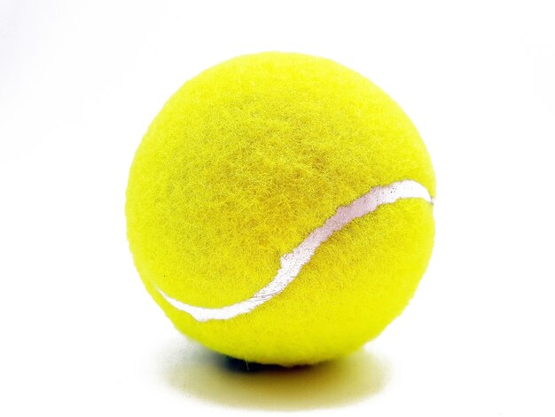 Closeup shot of a tennis ball on white surface