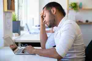 Free photo closeup shot of tired office worker