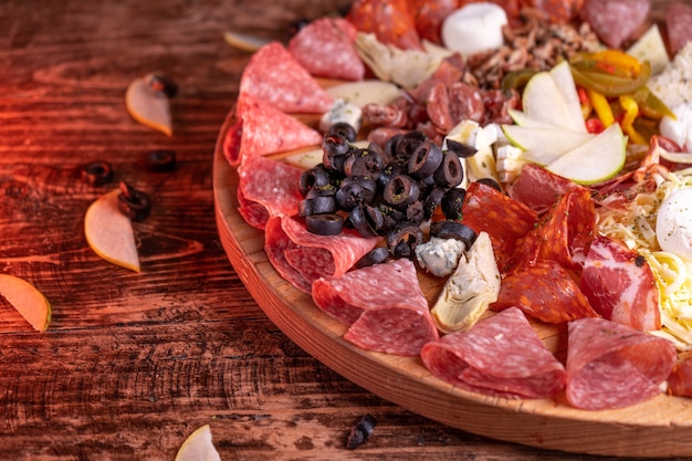 Closeup shot of a variety of meat assortment on a wooden surface