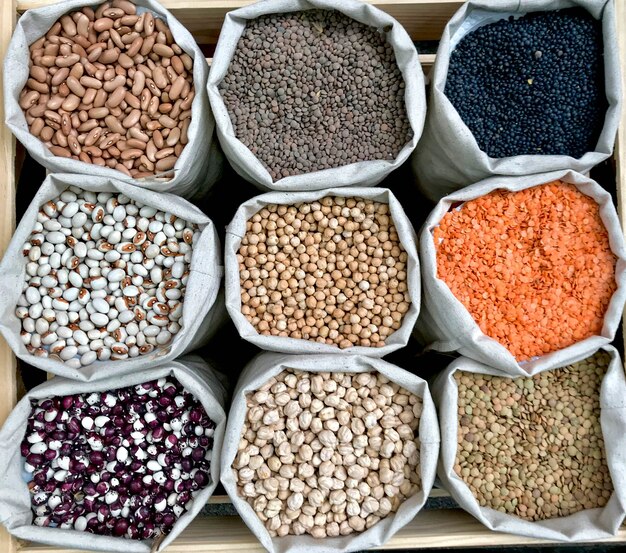 Closeup shot of various legumes in eco bags