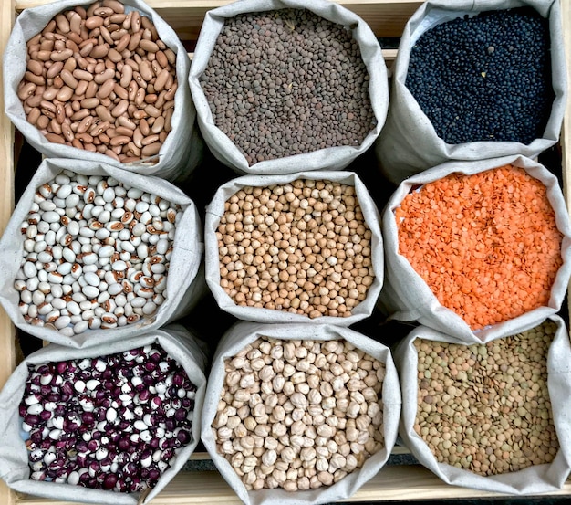 Closeup shot of various legumes in eco bags