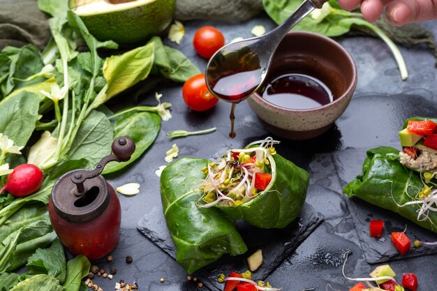 Closeup shot of a vegan wrap with red peppers and tomatoes