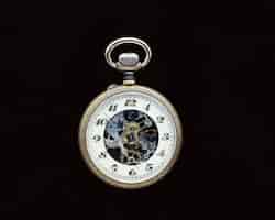 Free photo closeup shot of a vintage pocket watch on a black surface