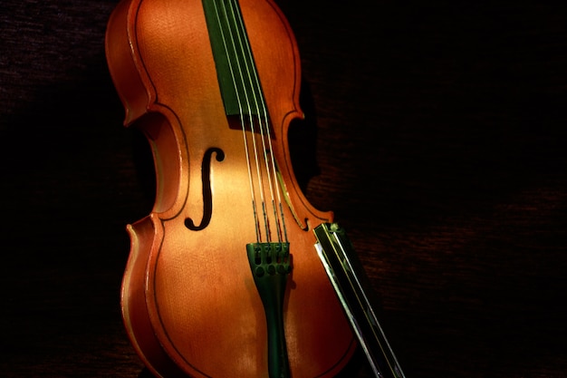 Closeup shot of a violin on with a dark background