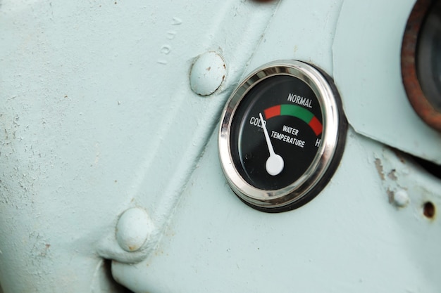 Closeup shot of a water temperature indicator on a ship