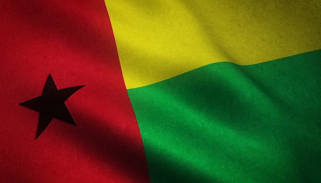 Closeup shot of the waving flag of Guinea Bissau with interesting textures