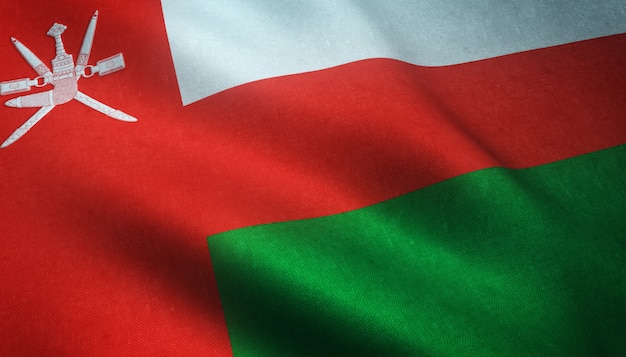 Снимок крупным планом развевающегося флага Омана с интересными текстурами