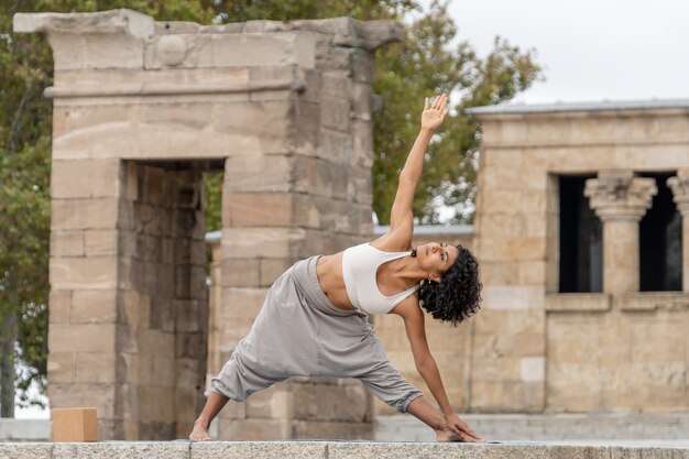 Closeup shot of a woman  practices yoga outdoor