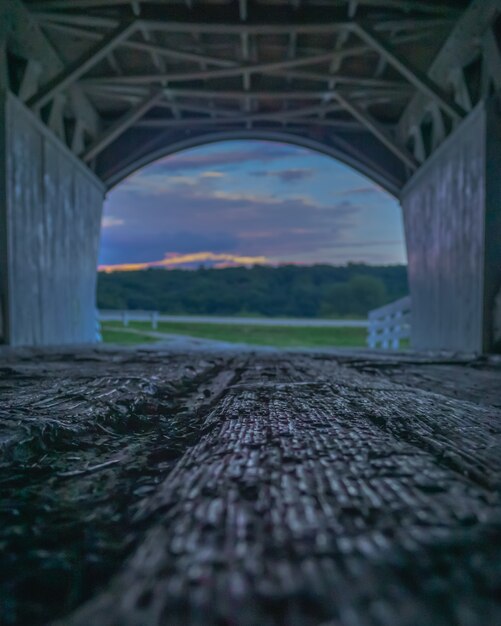 Closeup shot of a wooden bridge structure with amazing greenery