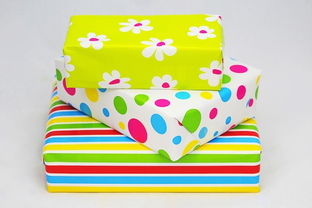 Closeup shot of wrapped colorful gift boxes on a white surface
