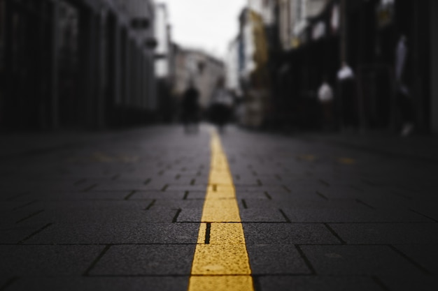 Closeup shot of a yellow line on the street