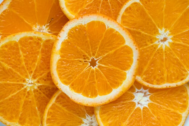 スライスされたジューシーなオレンジの背景は、テクスチャ背景