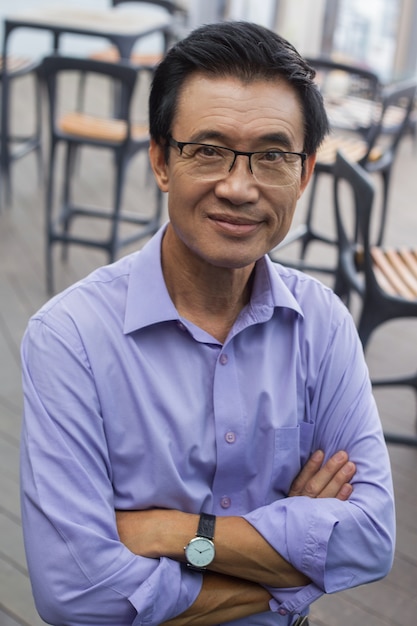 Closeup of Smiling Senior Man in Cafe